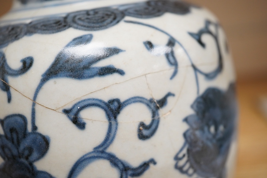 A Chinese blue and white Lion-dog jar and cover, late Ming dynasty, 17cm. Condition - poor